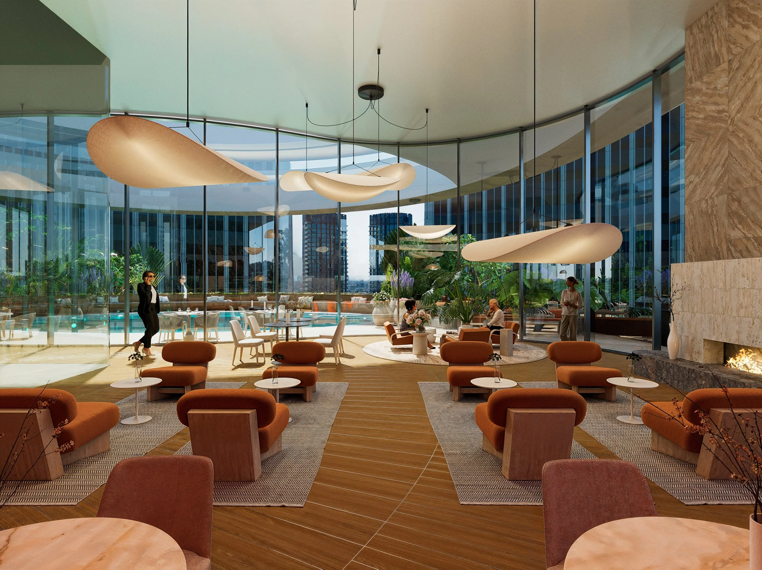 Modern hotel lobby with comfortable seating, hanging light fixtures, large windows, indoor plants, and a fireplace.