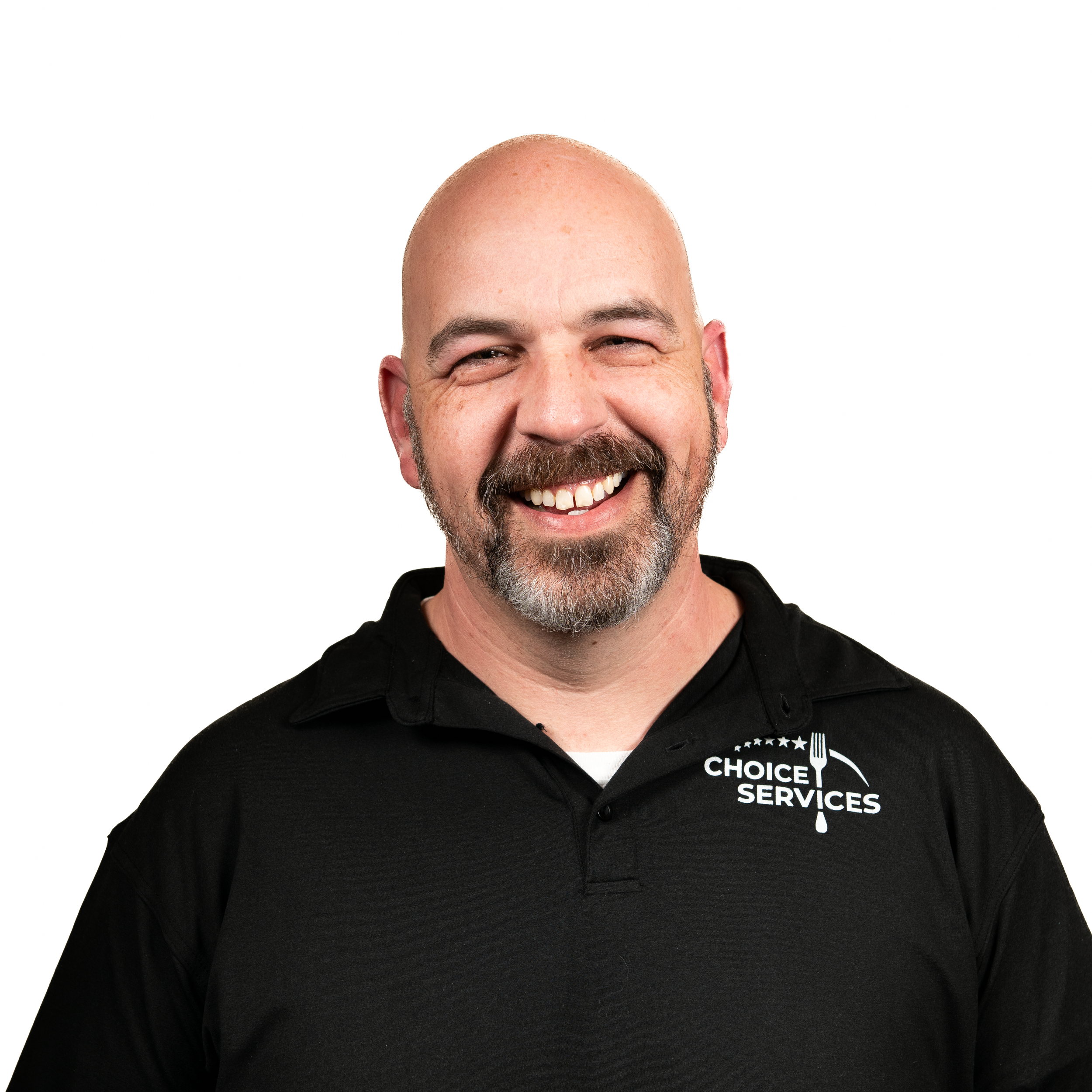 A smiling bald man with a beard wearing a black polo shirt with a 'Choice Services' logo.