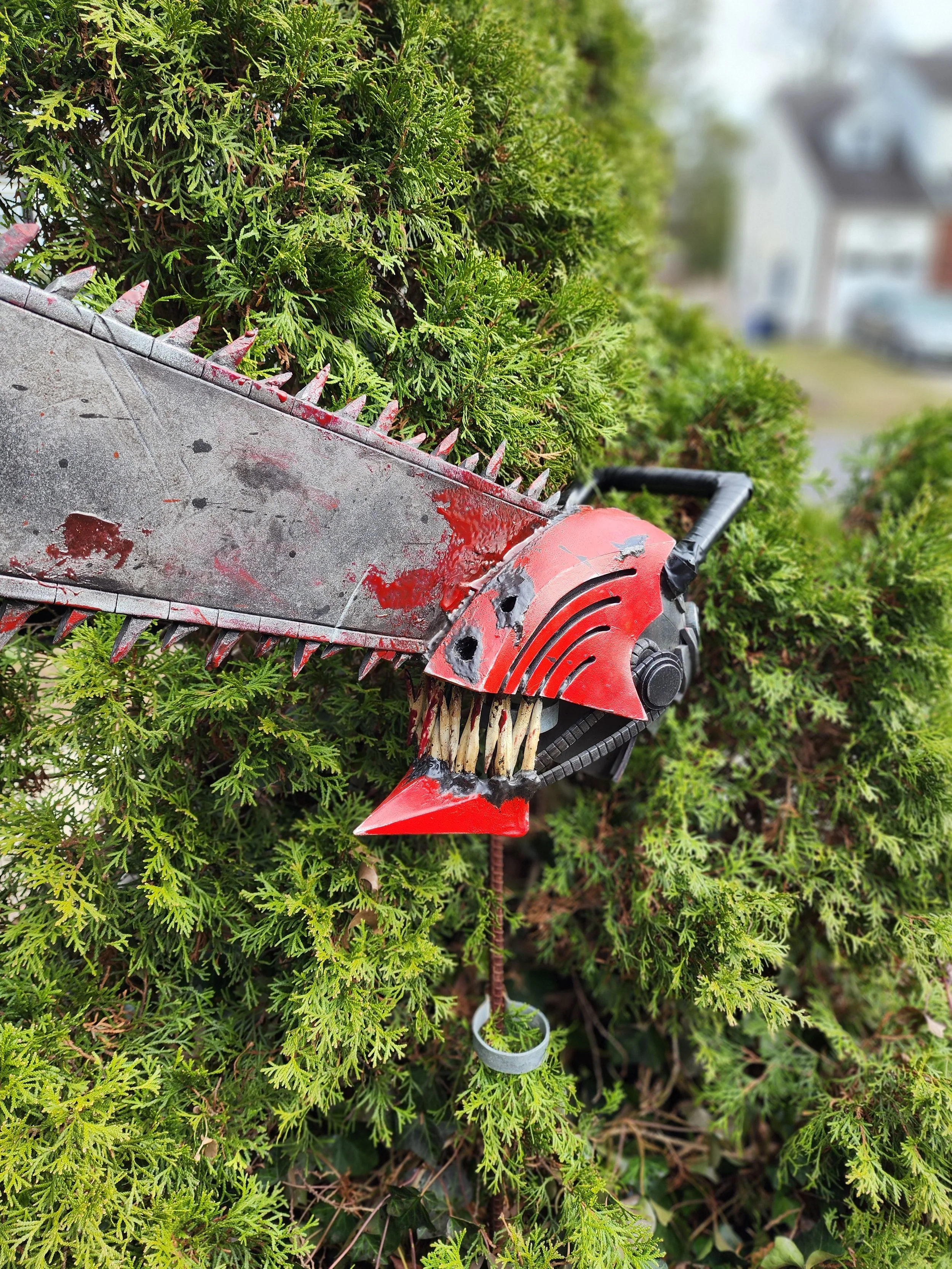 Chainsaw man mask from Chainsaw Man -  
EVA foam, epoxy, plastidip, acrylic paint, kit bash details