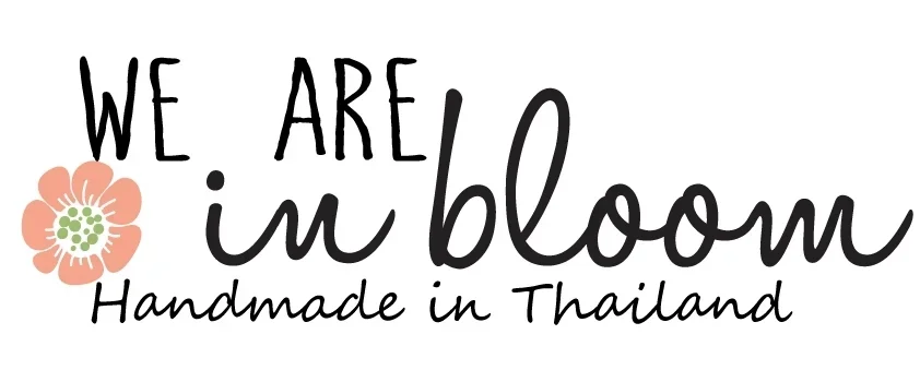 Text saying "We Are In Bloom" and "Handmade in Thailand" with a flower illustration.