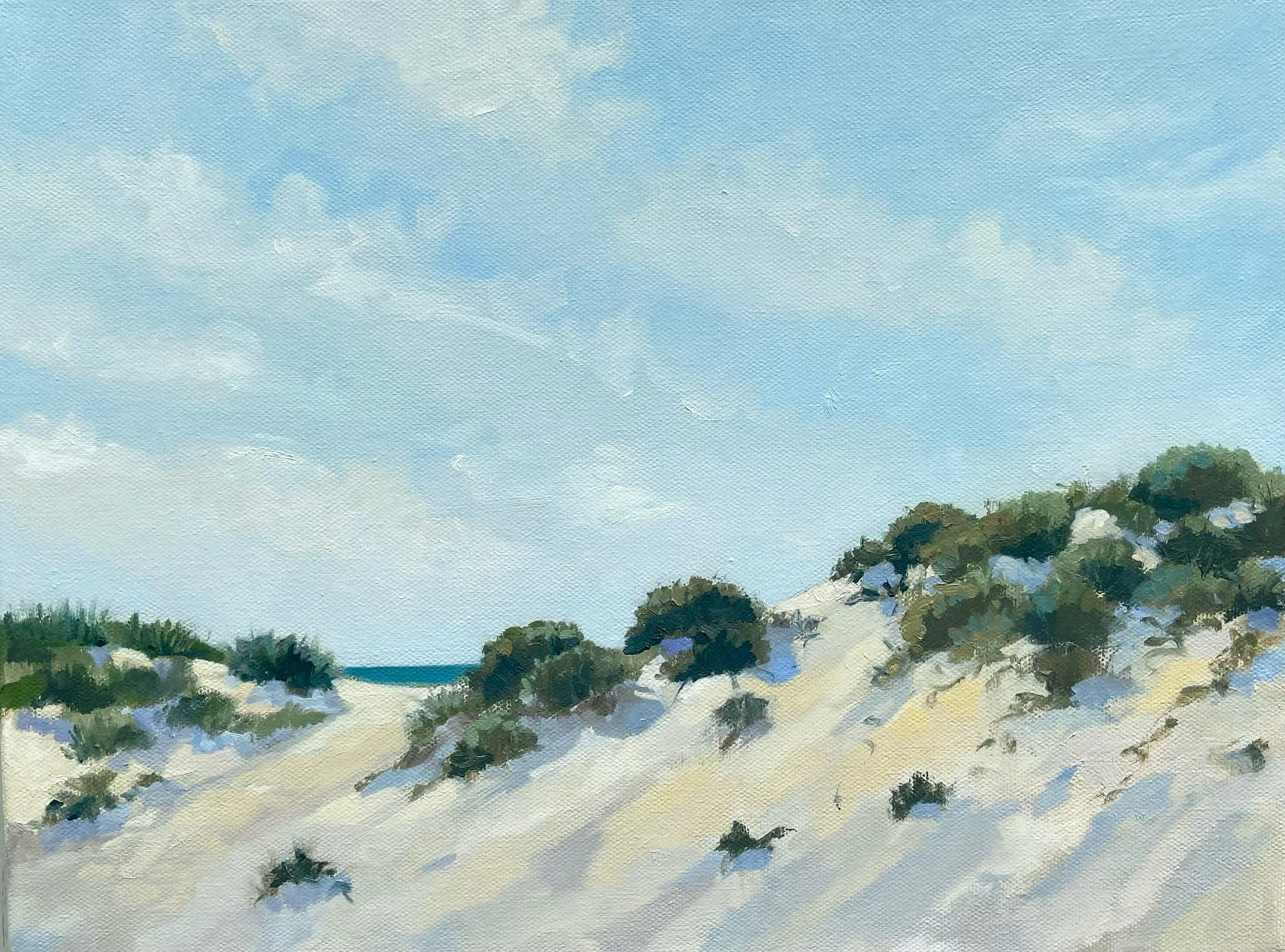 A painted landscape of sand dunes with green shrubbery and a clear blue sky with some clouds.