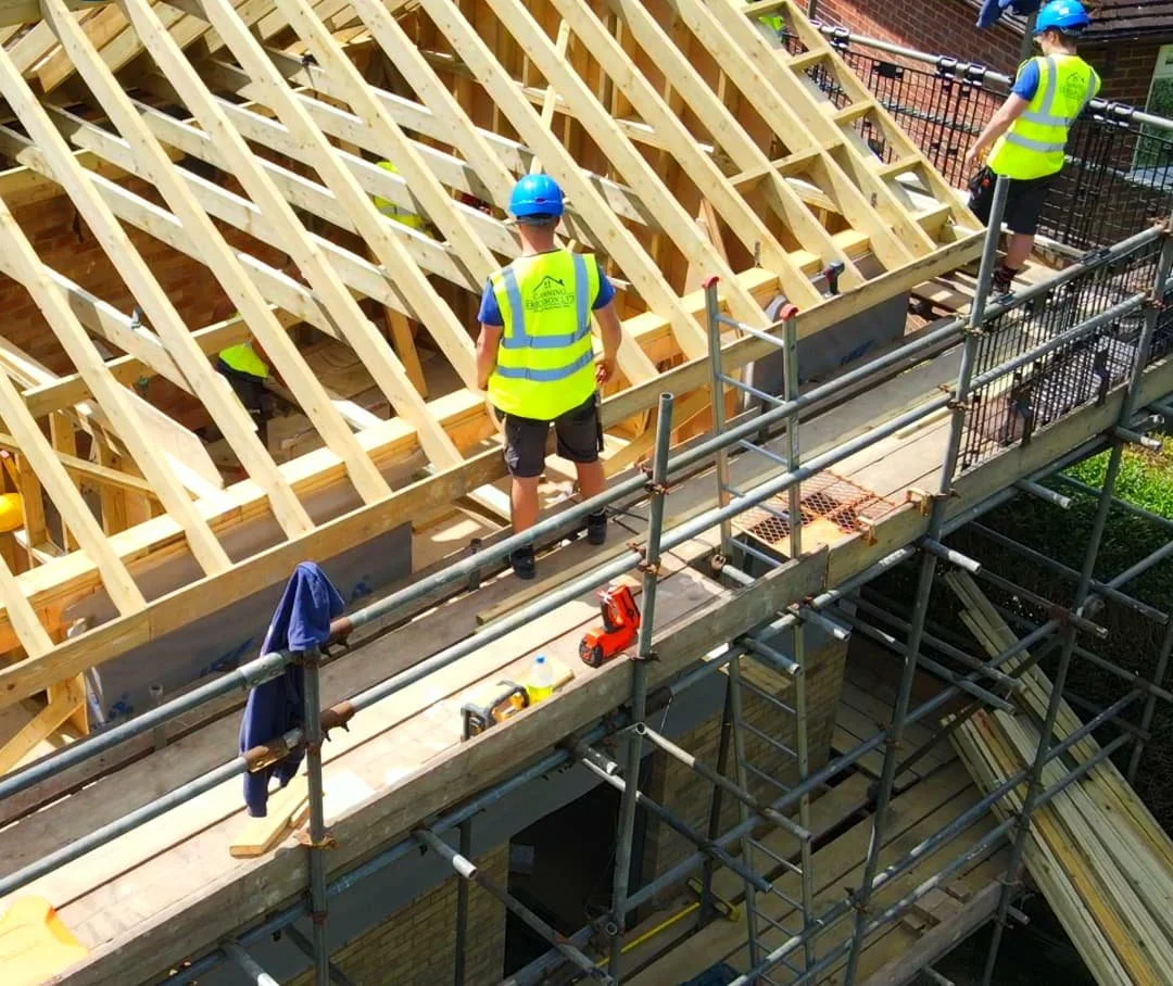 Canning Ericsson team working on the timber roof structure of a residential build in Sussex