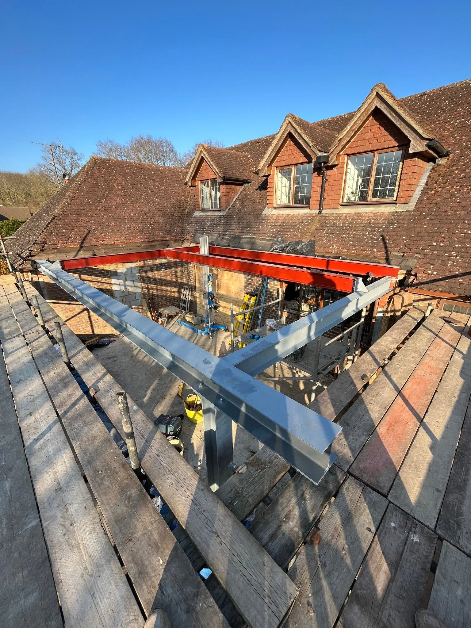 Structural steel frame installation during a residential renovation project by Canning Ericsson.