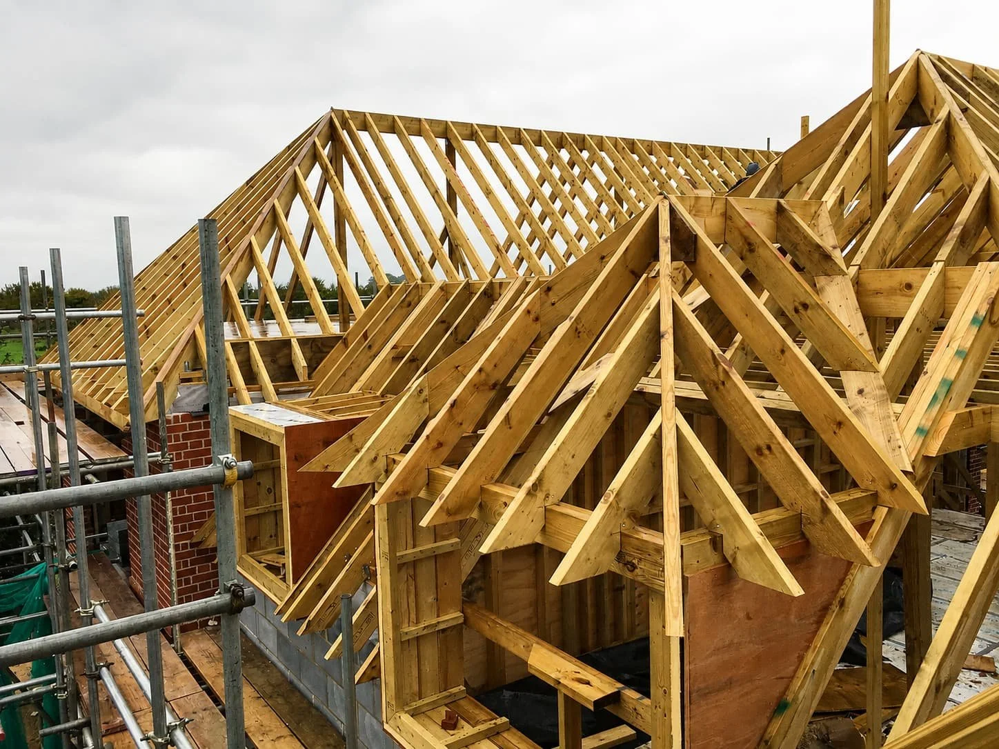 Timber roof structure under construction on a new-build home in Sussex