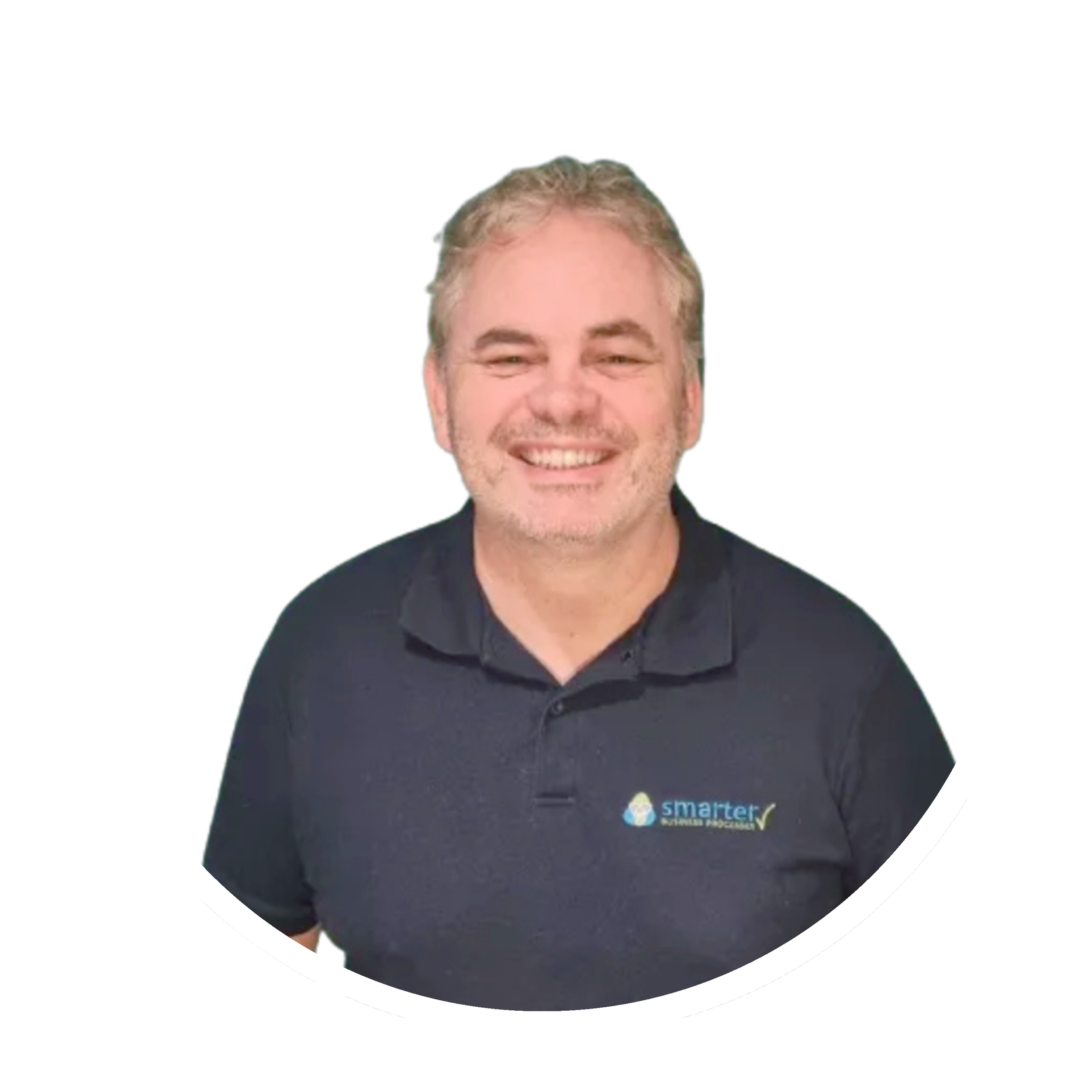 A smiling man with gray hair and a beard wearing a black Smarter Business Solutions polo shirt, standing against a white background with a black and white graphic design element.