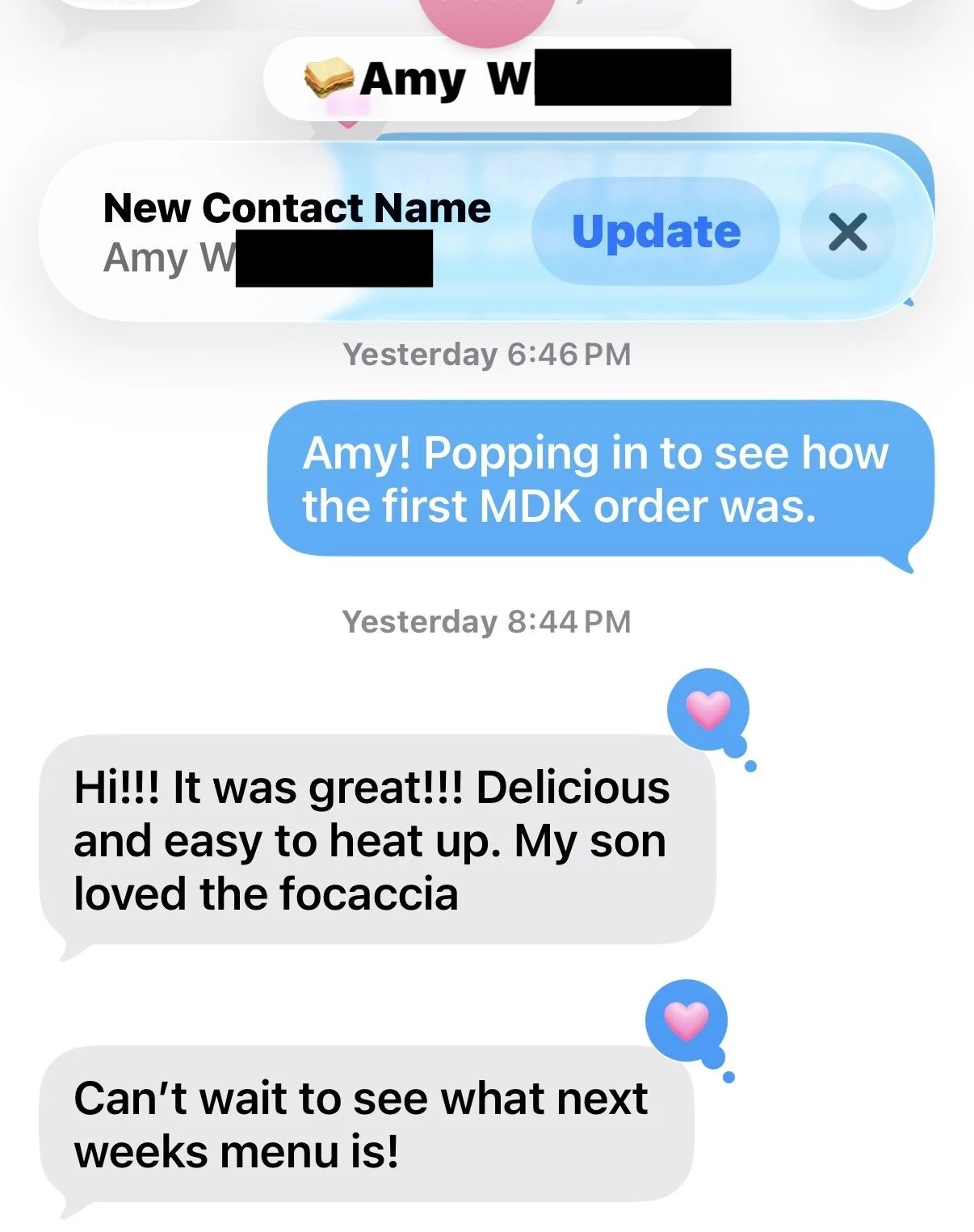 Text message conversation about a food order and review, featuring blue and gray message bubbles with a pink heart icon.