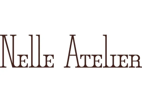 Logo with the text 'Nelle Atelier' in brown serif font on a white background.