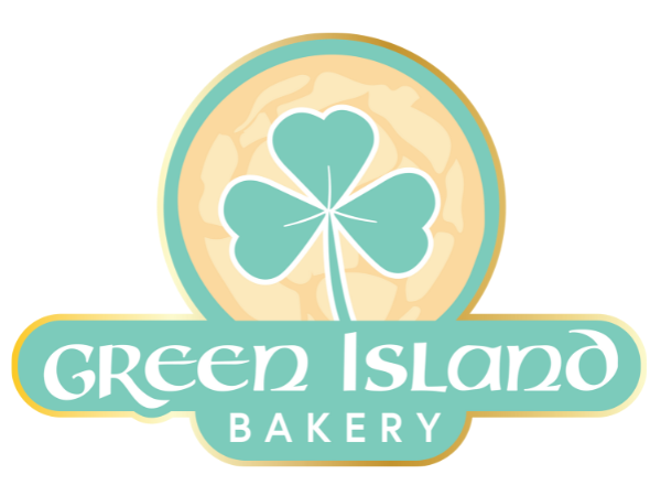 Logo for Green Island Bakery featuring a bowtie-shaped green leaf inside a circular cookie or biscuit, with the bakery's name in stylized font below.