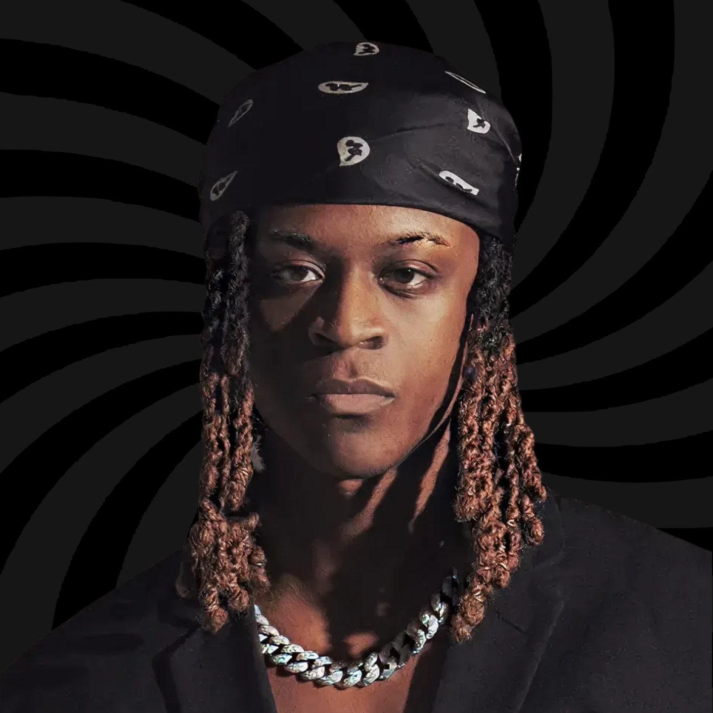 Portrait of a person wearing a black bandana with white patterns, a chunky silver chain necklace, and a black shirt, against a spiraling black and gray background.