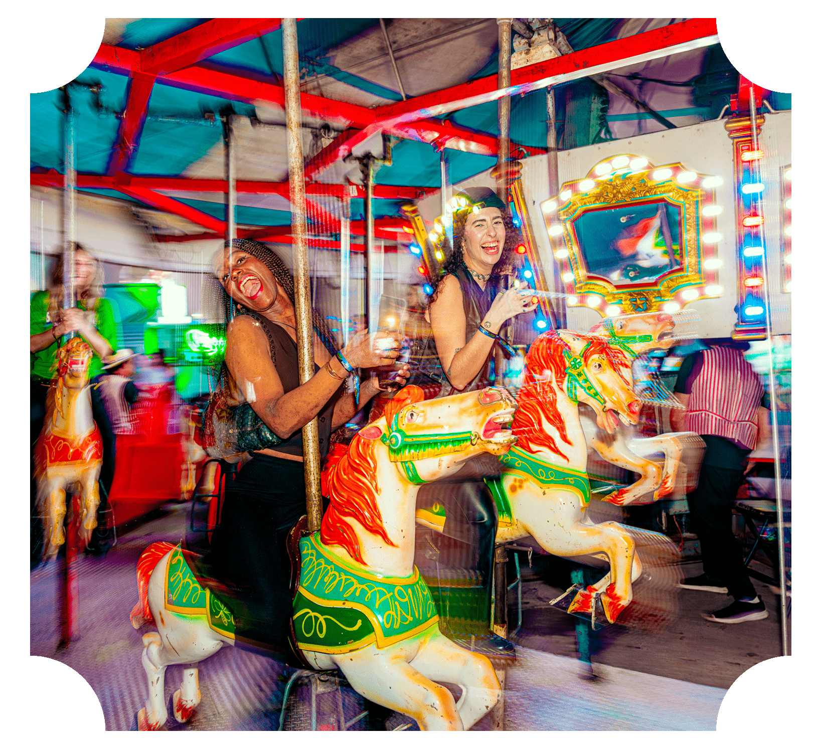 People riding a carousel with colorful horses at a fair, smiling and laughing under bright lights.