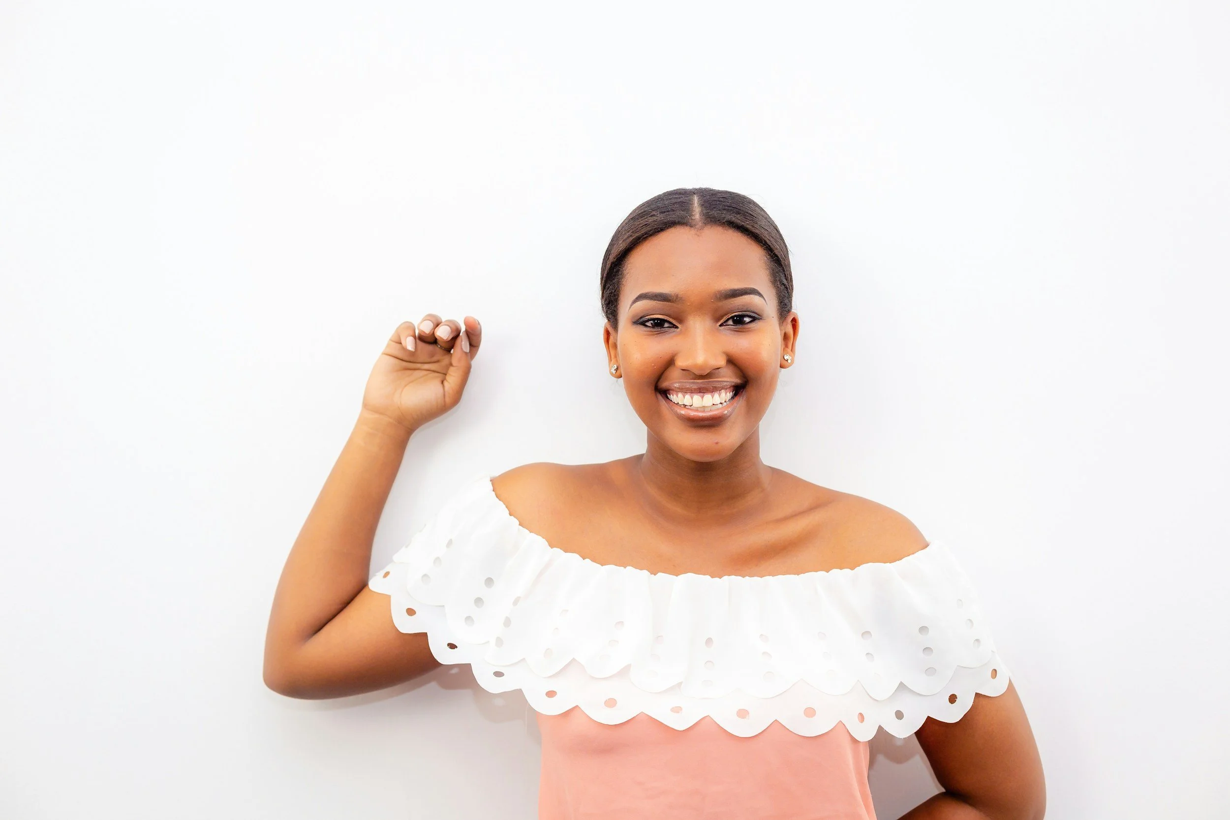 Confident woman smiling with her fist raised representing empowerment and self-trust through therapy for women