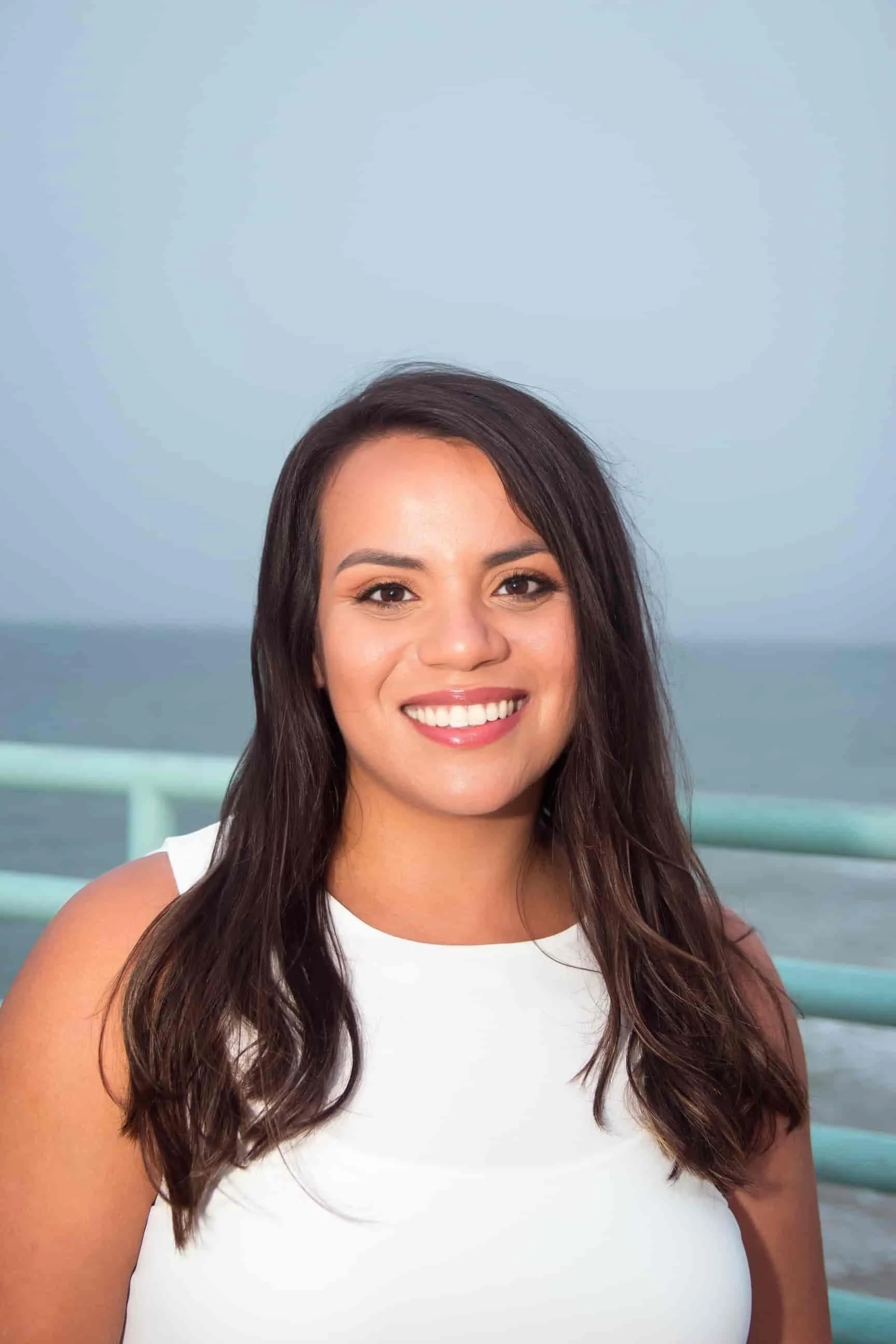 Alexa Gonzales, LCSW, trauma therapist and owner of Transcend and Align Therapy Services, smiling outdoors
