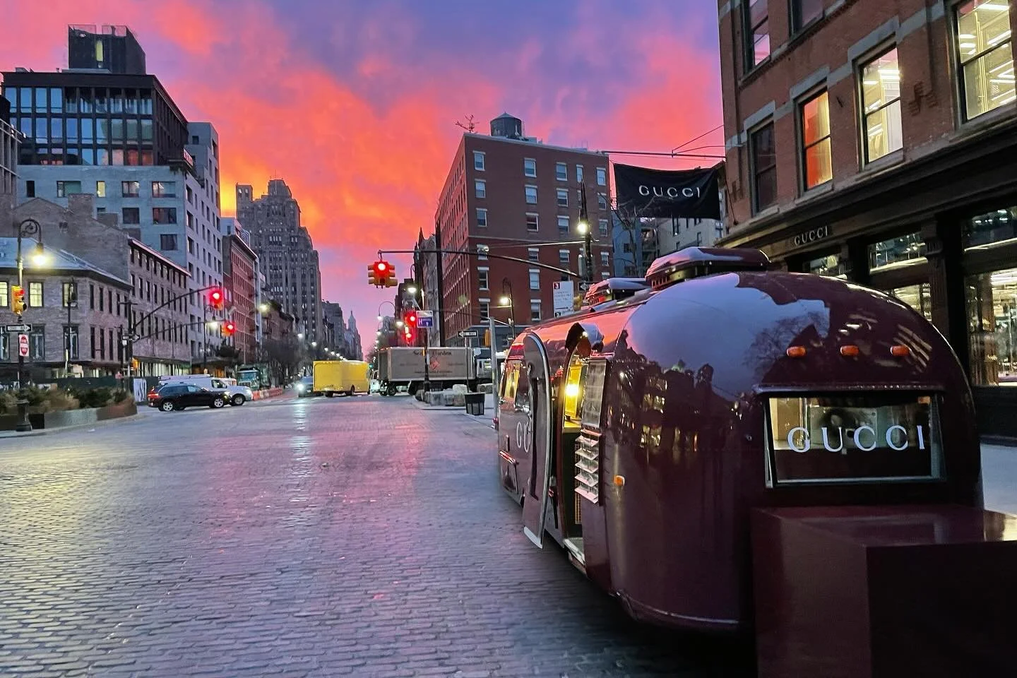 The burgundy Gucci Airstream glows under a vivid New York sunset outside the brand’s SoHo flagship. The pop-up coffee and flower bar became a viral street activation—merging luxury design, culture, and experiential marketing in the heart of Manhattan