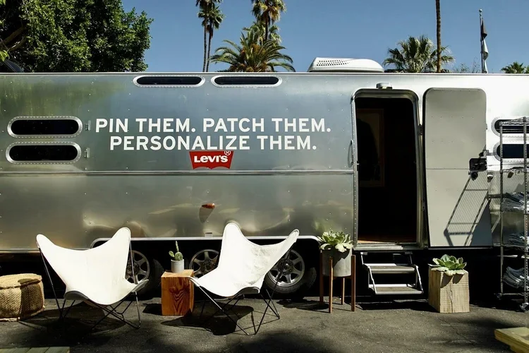 Levi’s Airstream activation offered a hands-on denim experience where customers could customize their pieces in a sleek mobile studio, blending craftsmanship and engagement for a new generation of shoppers.