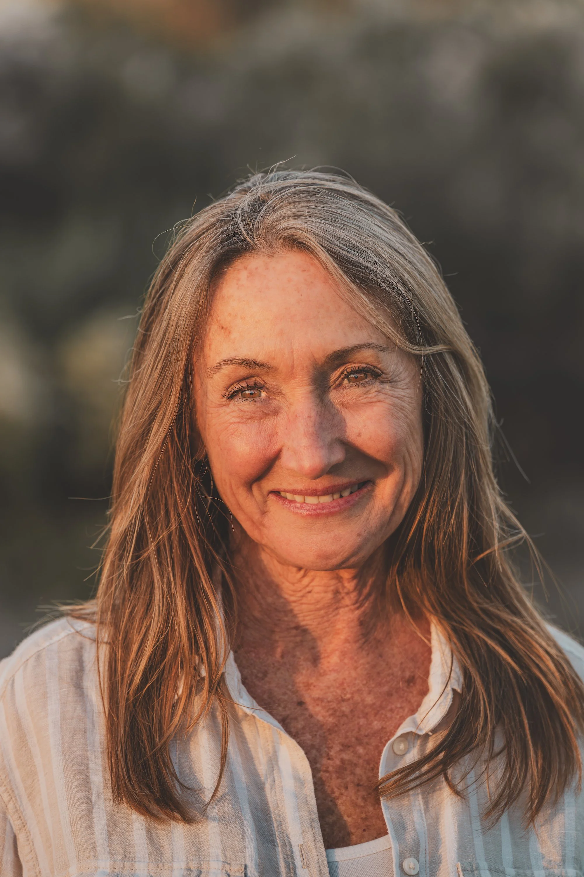 Amyris Wilson smiling outdoors during sunset or golden hour in Ojai, California.