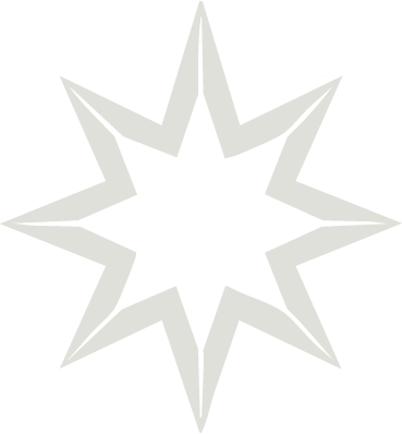 Estrella de ocho picos de color gris sobre fondo negro.