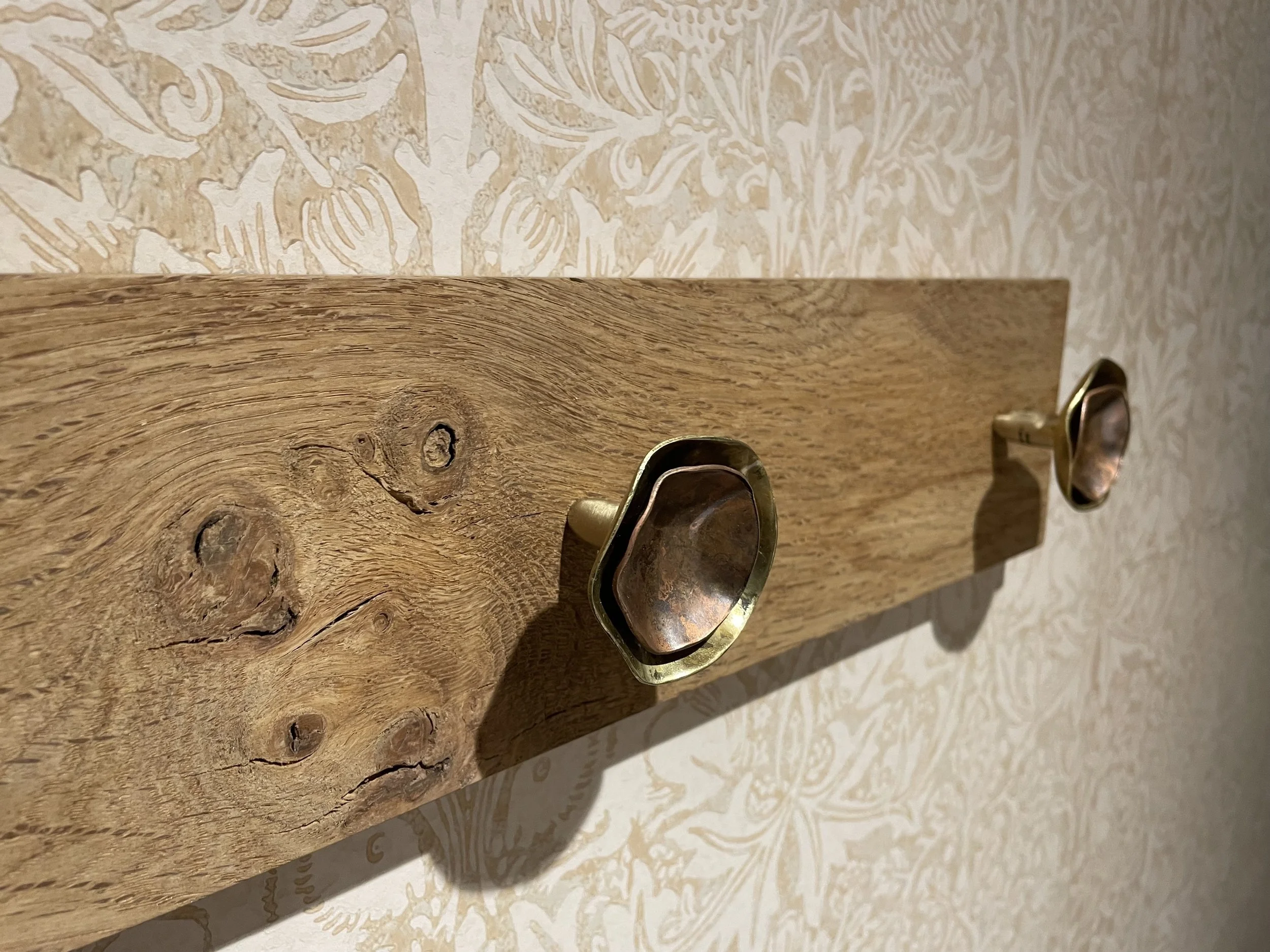 Copper and brass coat hooks.jpeg