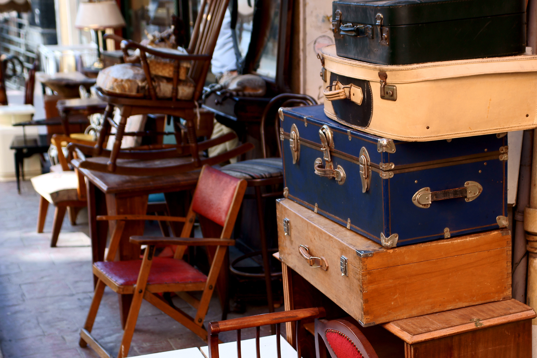 Furniture and household contents arranged for an on-site estate sale inside a private home.