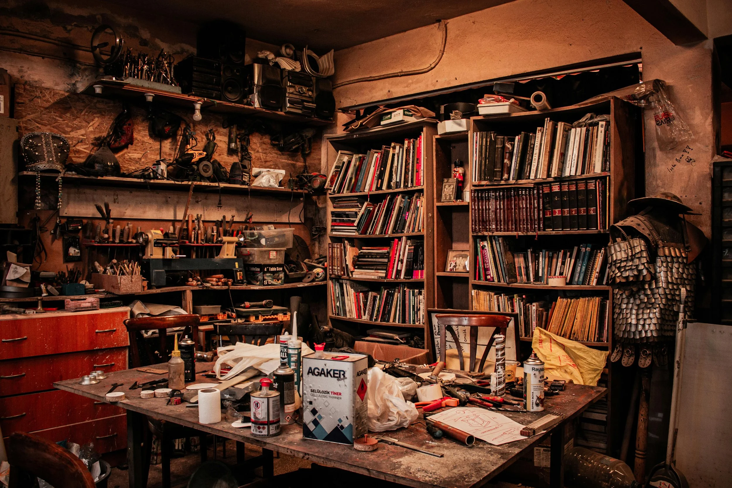 cluttered room full of tools and supplies