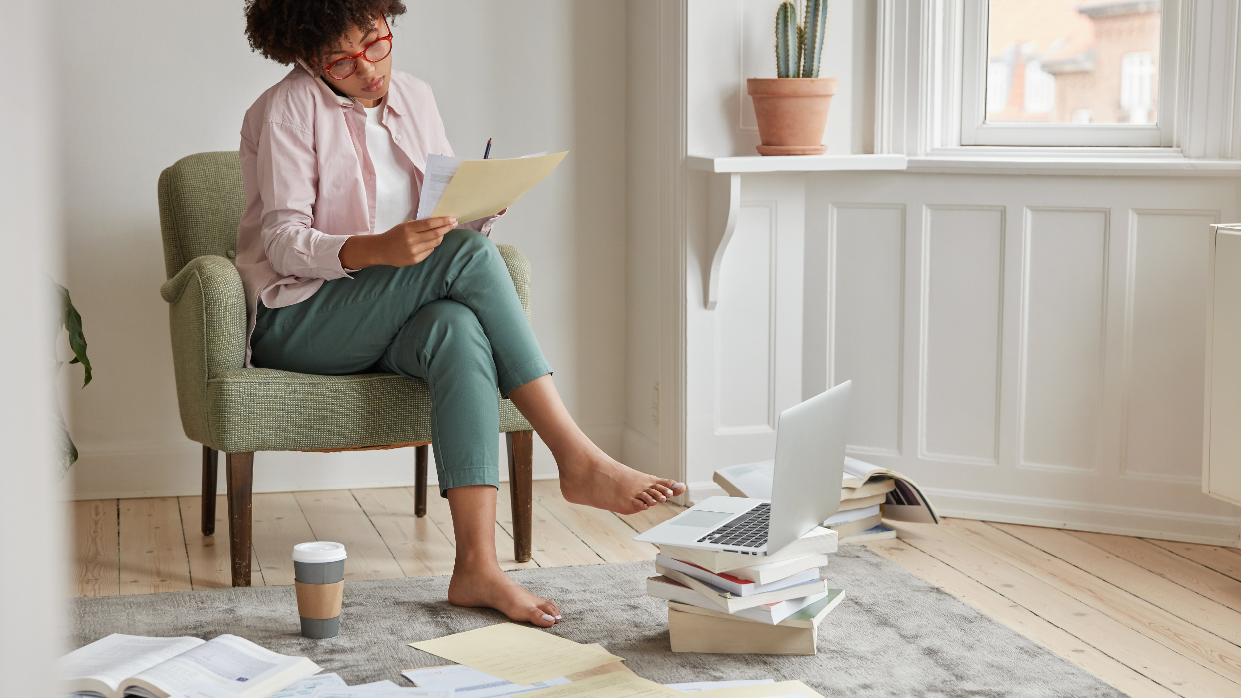 person reviewing documents and evaluating information during estate planning or estate clear out decision process at home