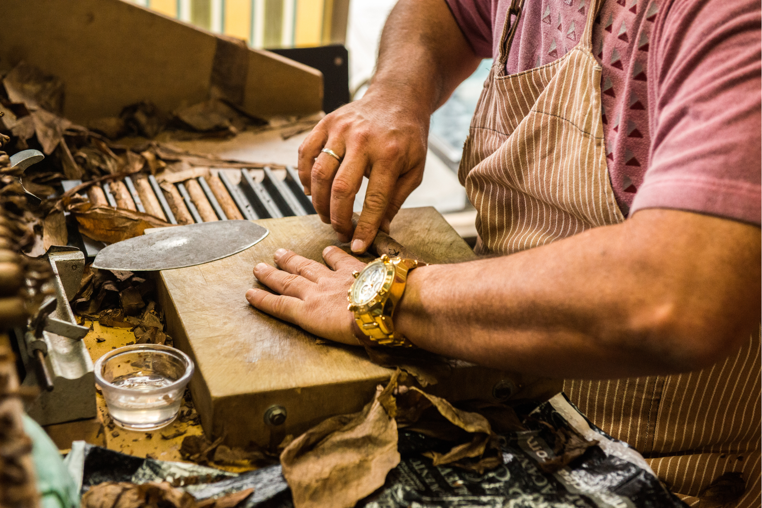 A close-up of hands working with specialized tools and materials, representing the kind of skilled hobbies or trades where valuable items may be overlooked by those unfamiliar with their use or significance.