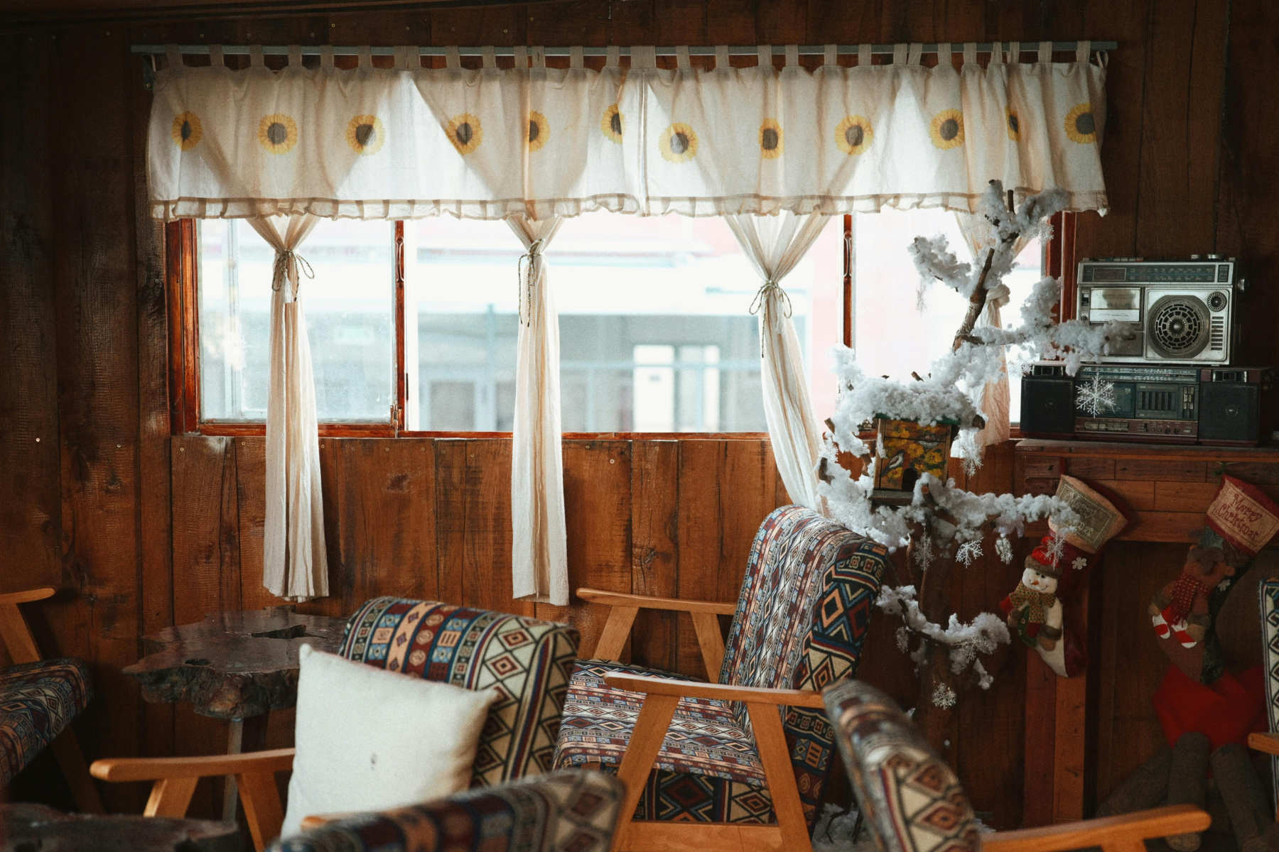 A lived-in living room with vintage furniture and personal items, showing a home in transition before estate contents are managed.