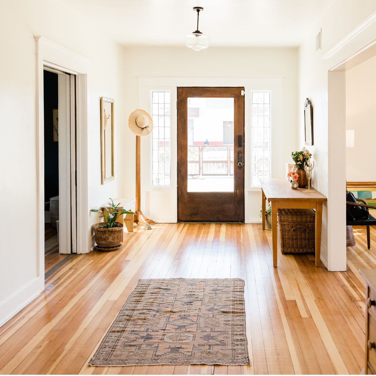 A clean, staged home entryway with natural light, illustrating preparation of a residence for listing or sale.