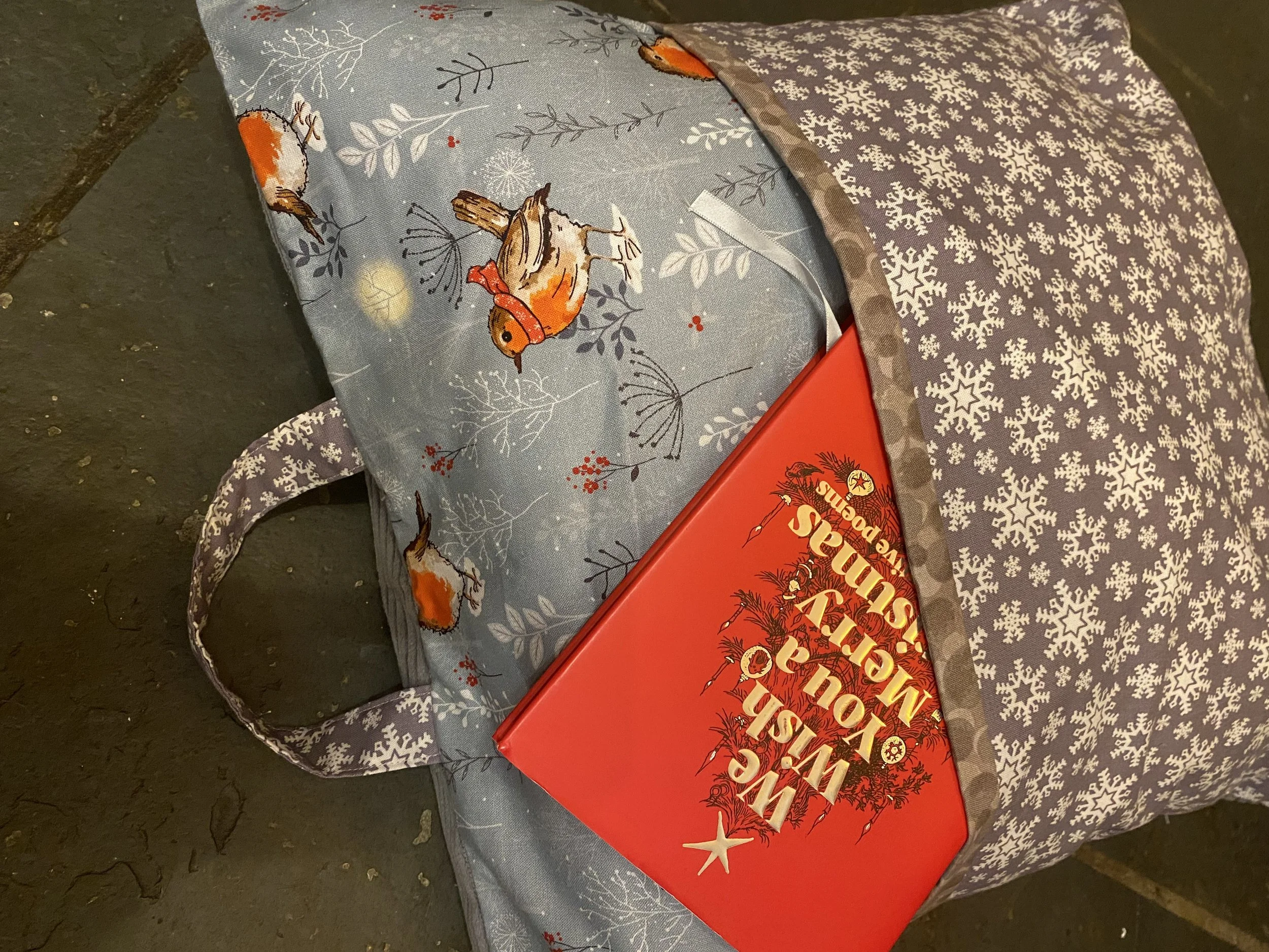 Cushion cover with book/magazine pocket and carry handle