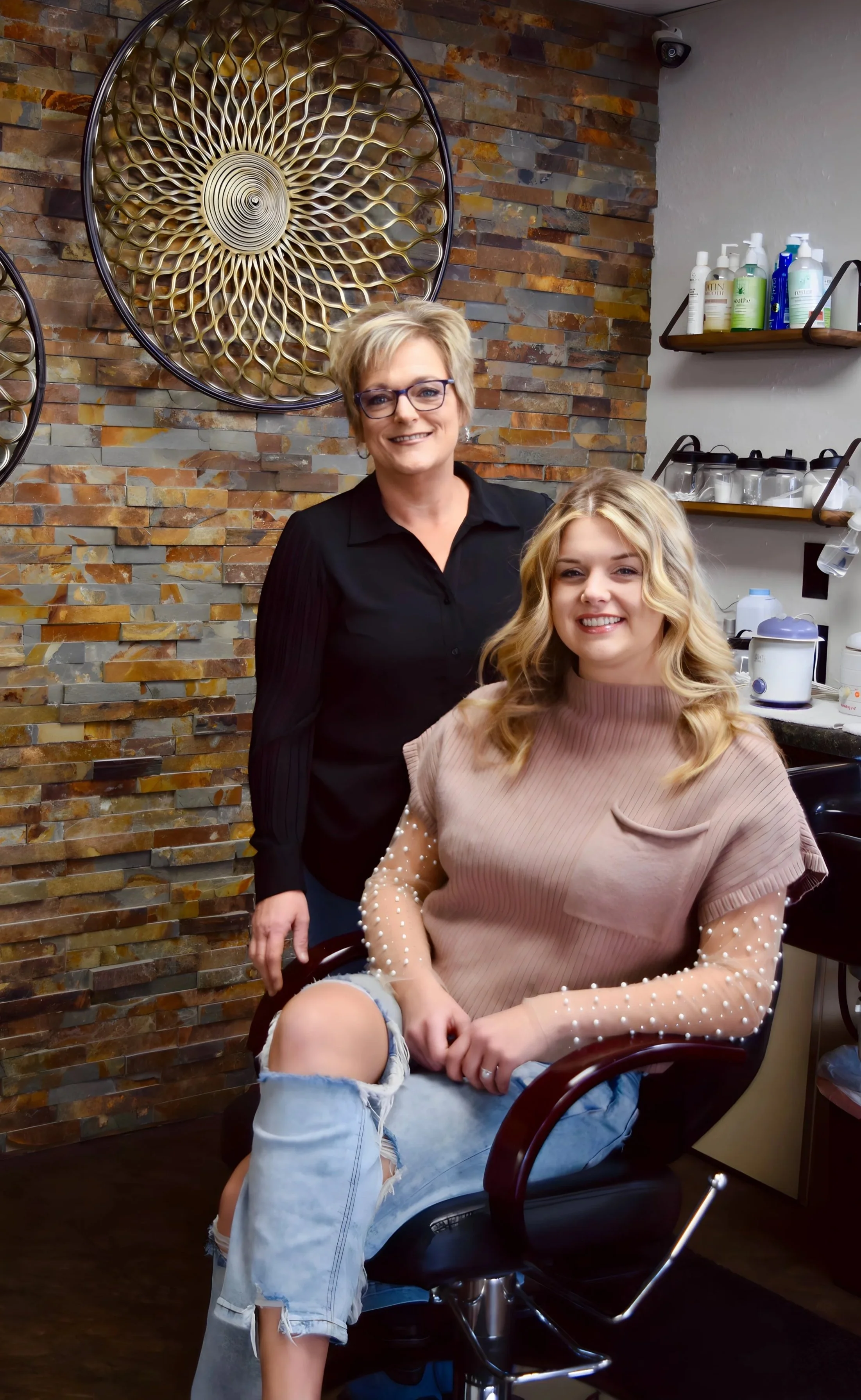 Jen Craft, Owner of New Dimensions Salon & Boutique with stylist Kristen Craft.