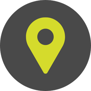 A yellow map location pin on a dark gray circular background.