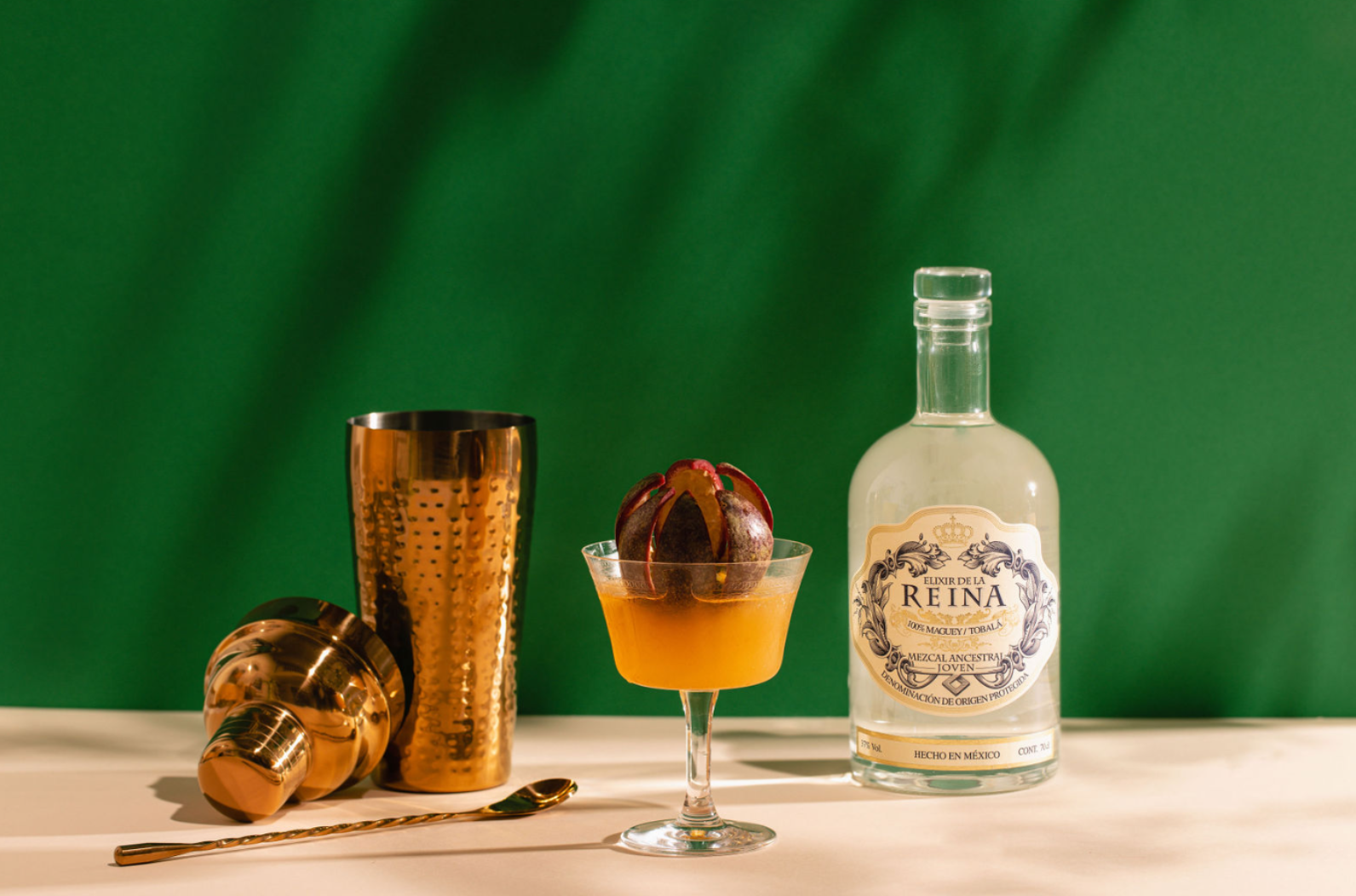 Glass bottle on a green background