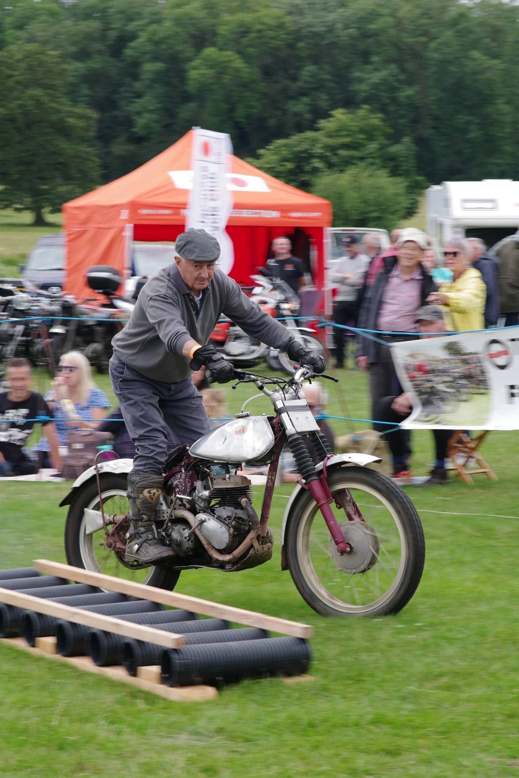 BSA C10 trials bike being ridden round the founders Day arena .