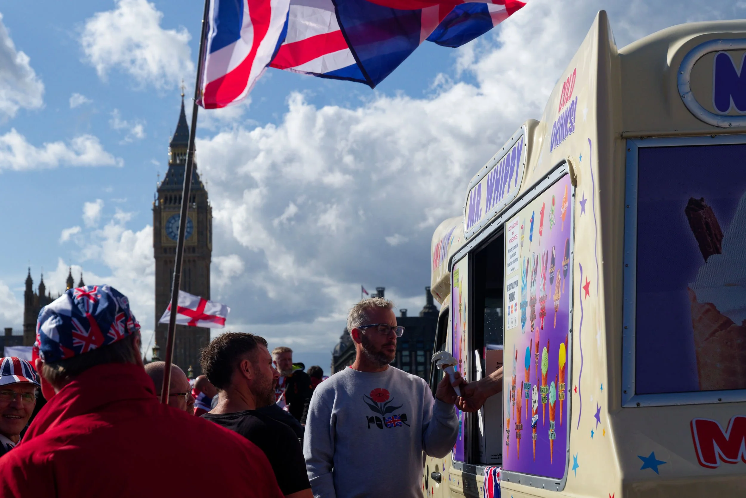 Unite the Kingdom marcher buys an ice cream on Westminster bridge.