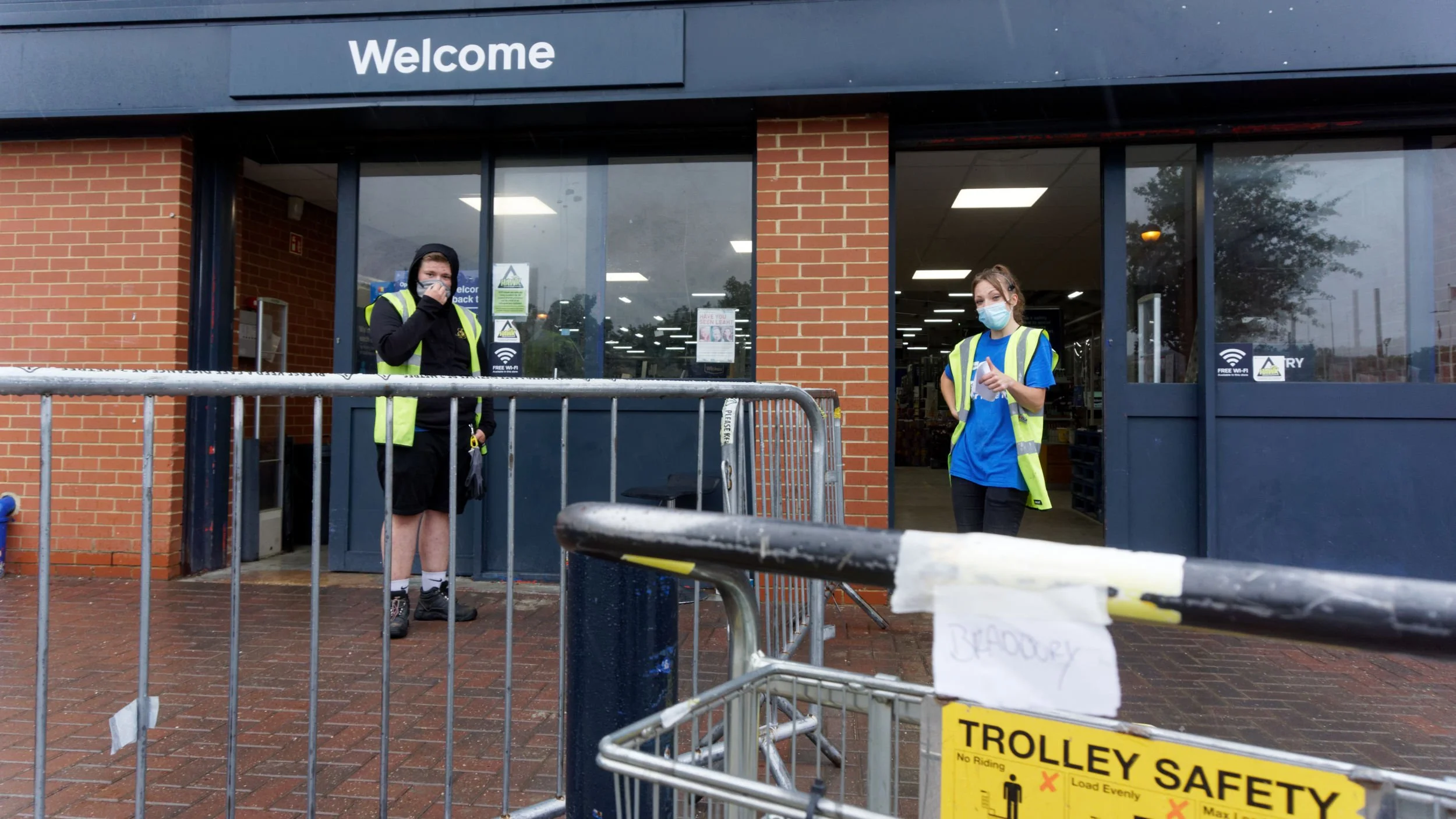 Staff at entrance to Wickes watching as I pick up my order.