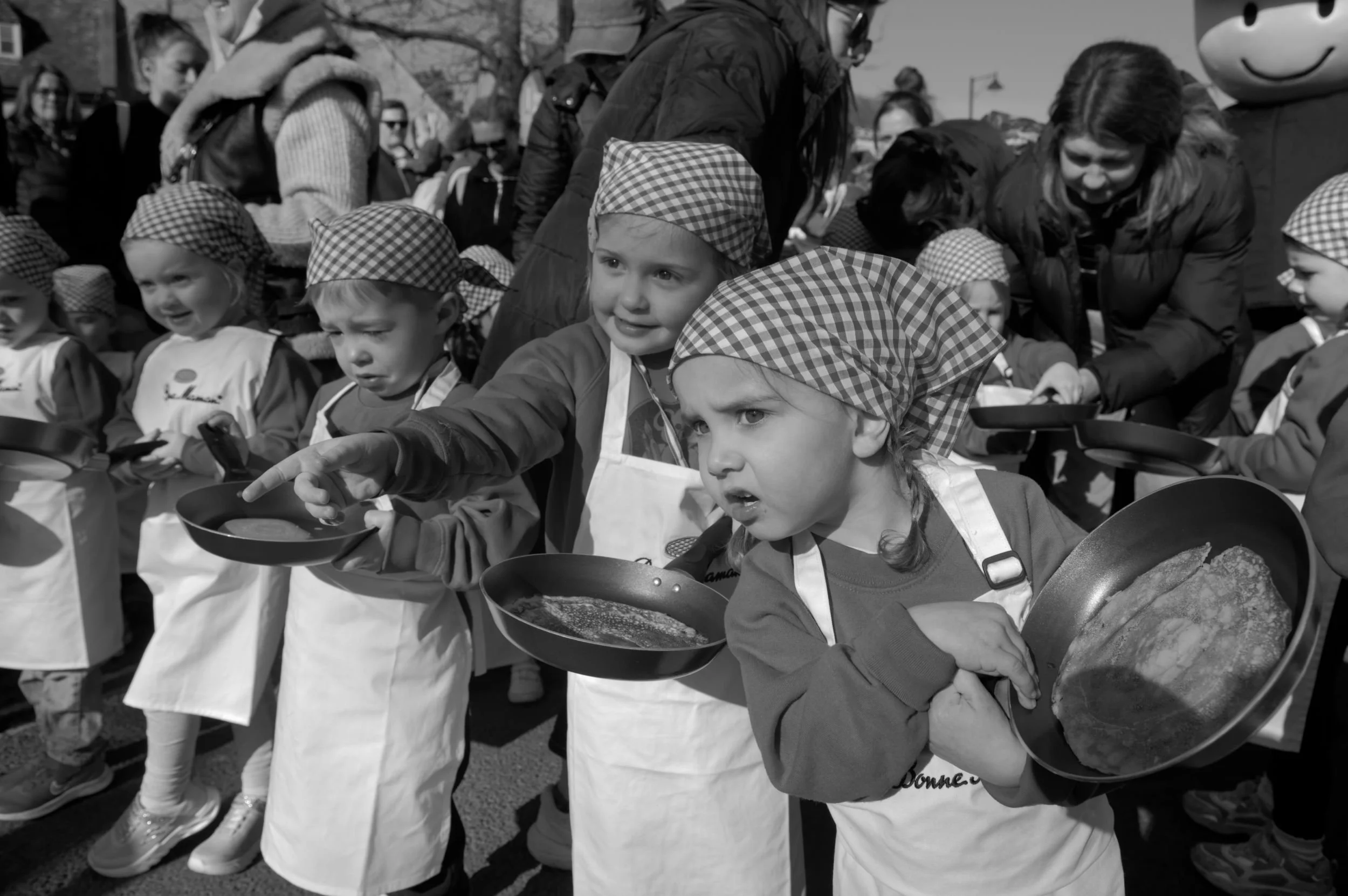 Olney children on the start line, ready to race on pancake day.