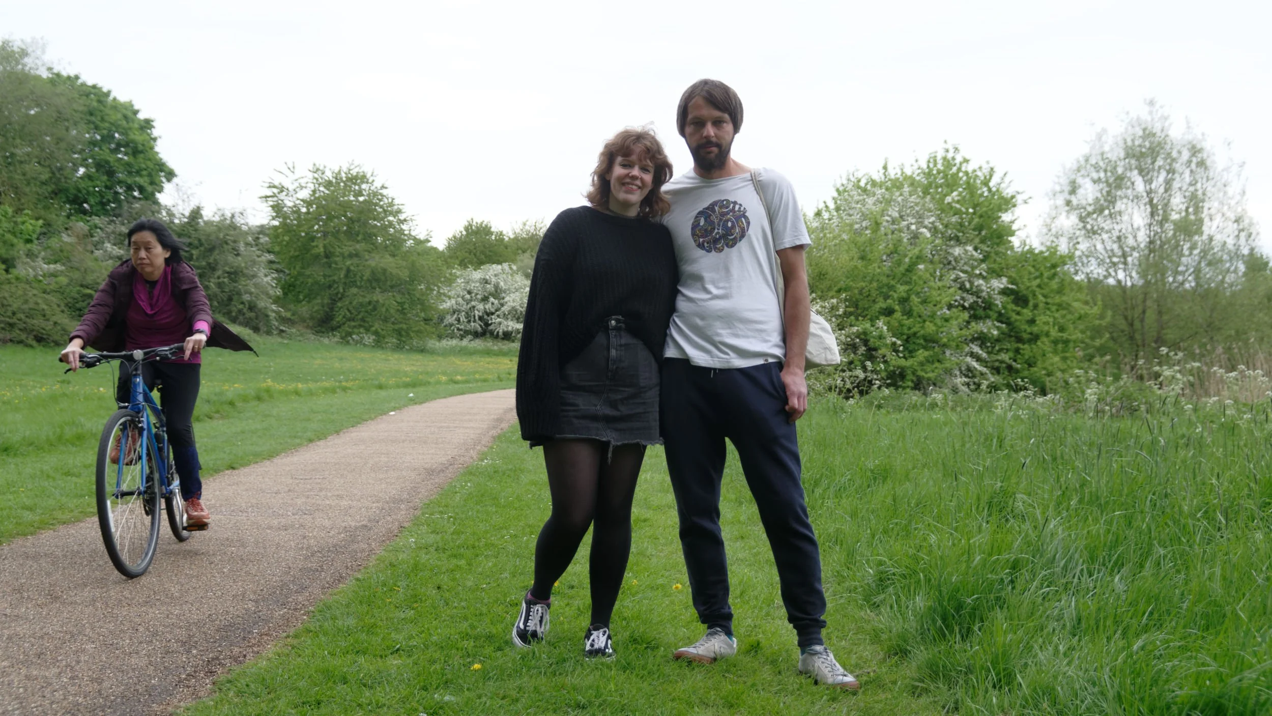 Cyclist passes a couple with two metres clearance during Covid Lockdown.