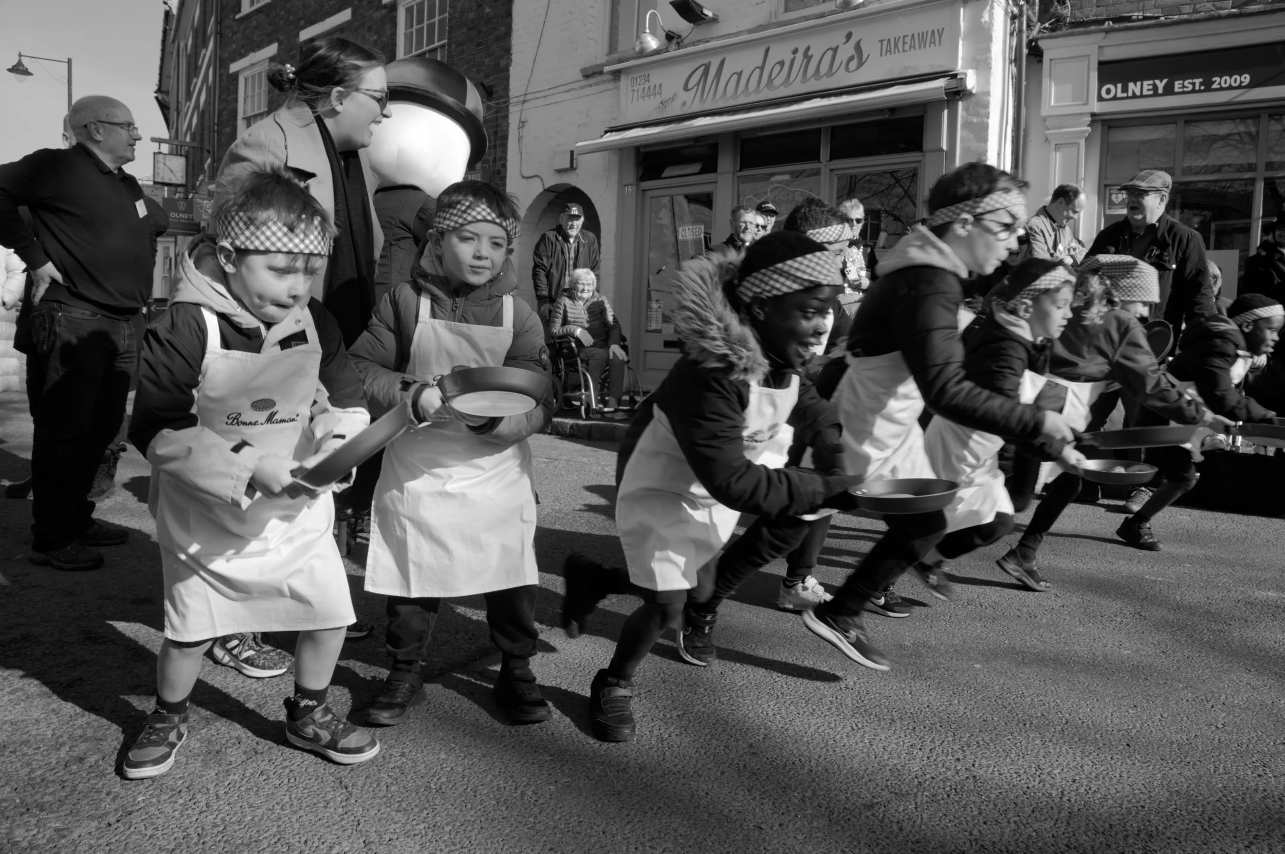 Start of a schoolboys' race on pancake day in Olney, Bucks.