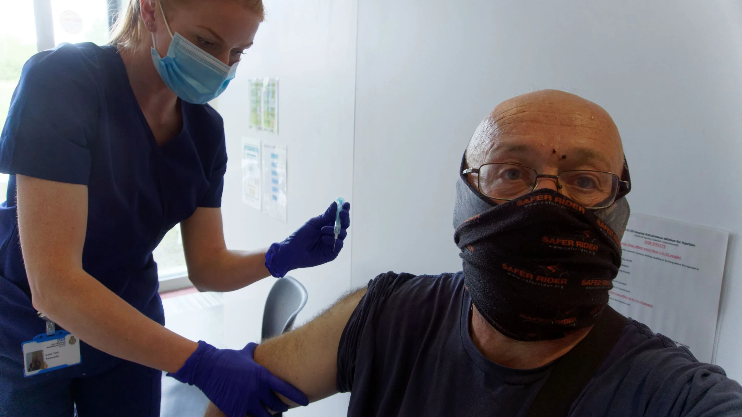 Self portrait, I'm receiving my second Covid vaccine jab from a medic.
