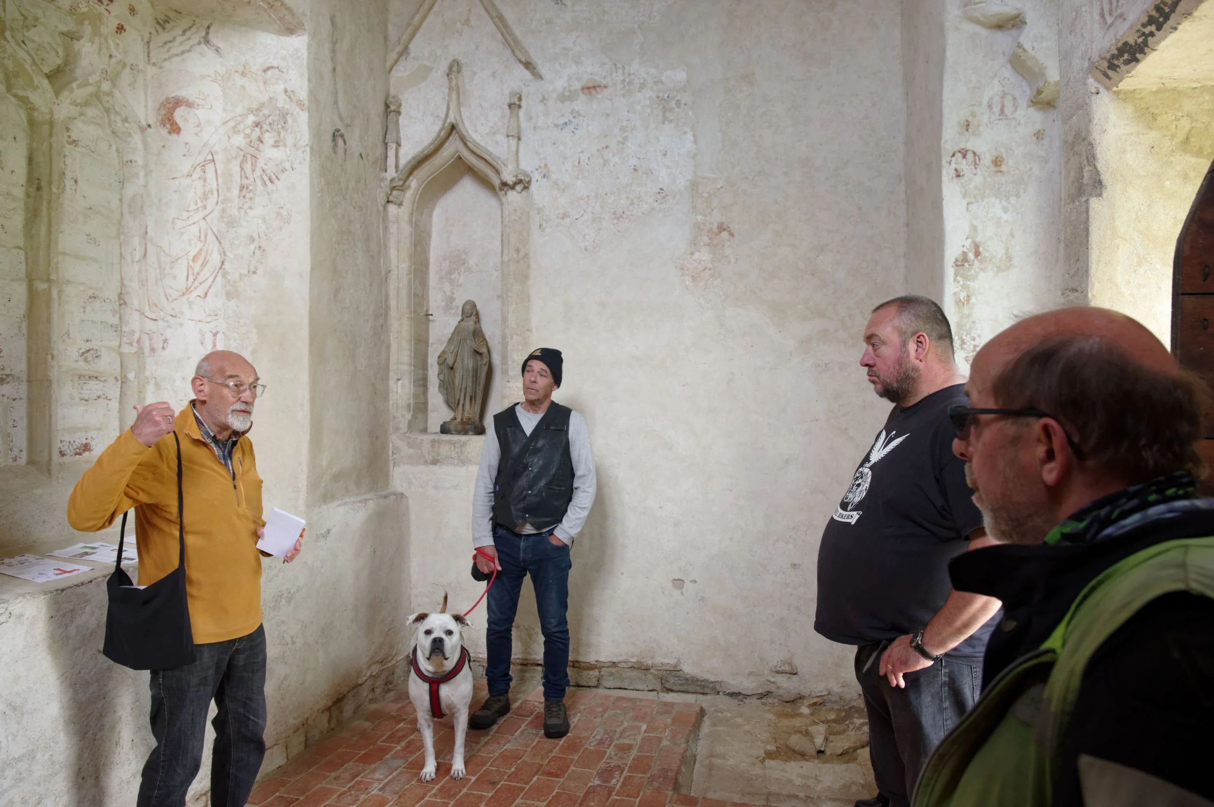 Bikers view the paintings at St Mary's Chapel, Bradwell Abbey, Milton Keynes.