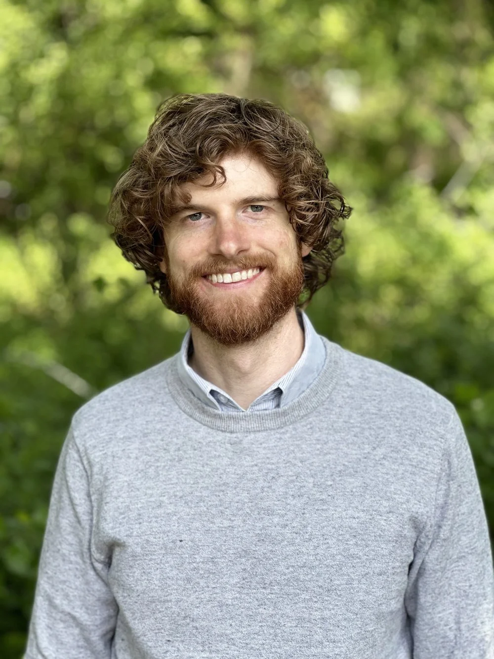 Dylan Lloyd wearing a grey sweater