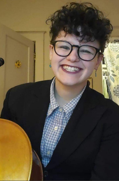 Cori Trenczer holding a cello