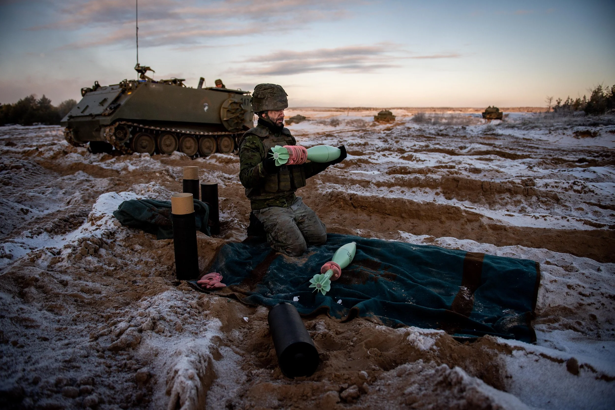 A Spanish service member prepares ordinance ahead of a live-fire exercise in Adazi, Latvia.