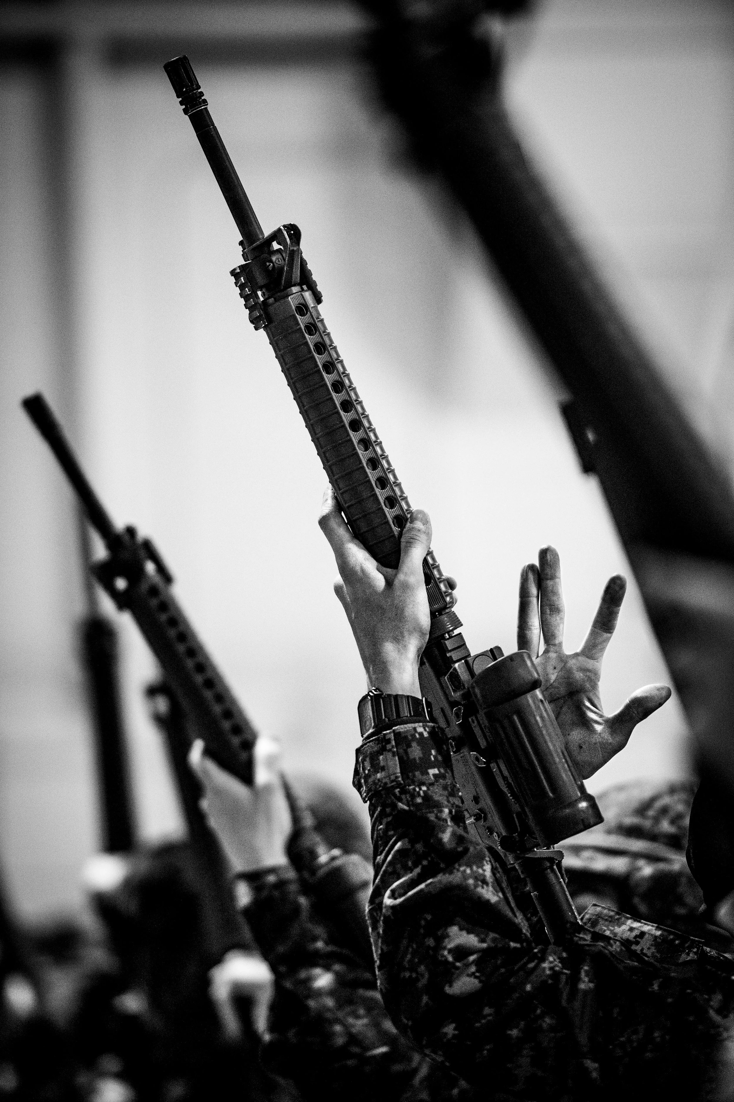 Basic Military Qualification course candidates perform individual safety precautions during weapons training in Borden, Ontario. 