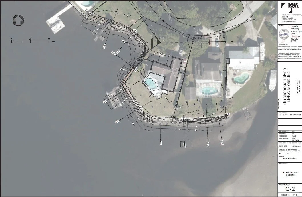 Aerial view of a shoreline with a house, swimming pool, and a boat dock, surrounded by water and greenery, with construction and property boundary lines overlaid.