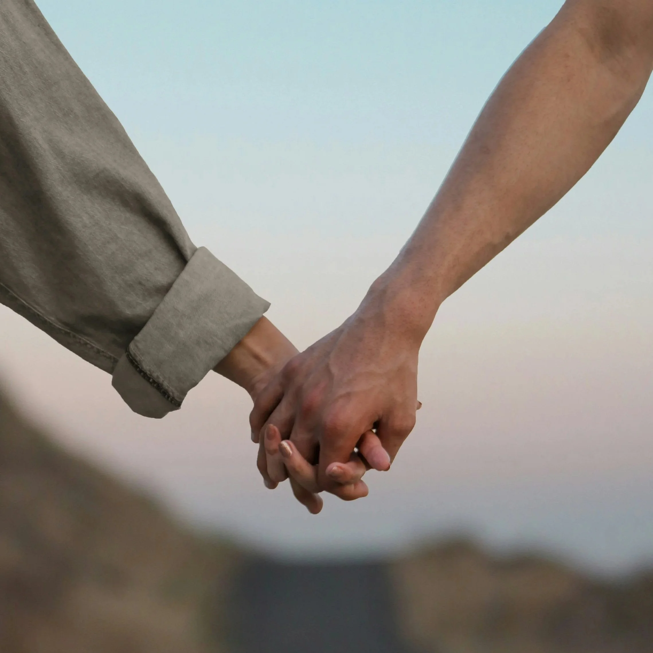 A couple in love, holding hands.