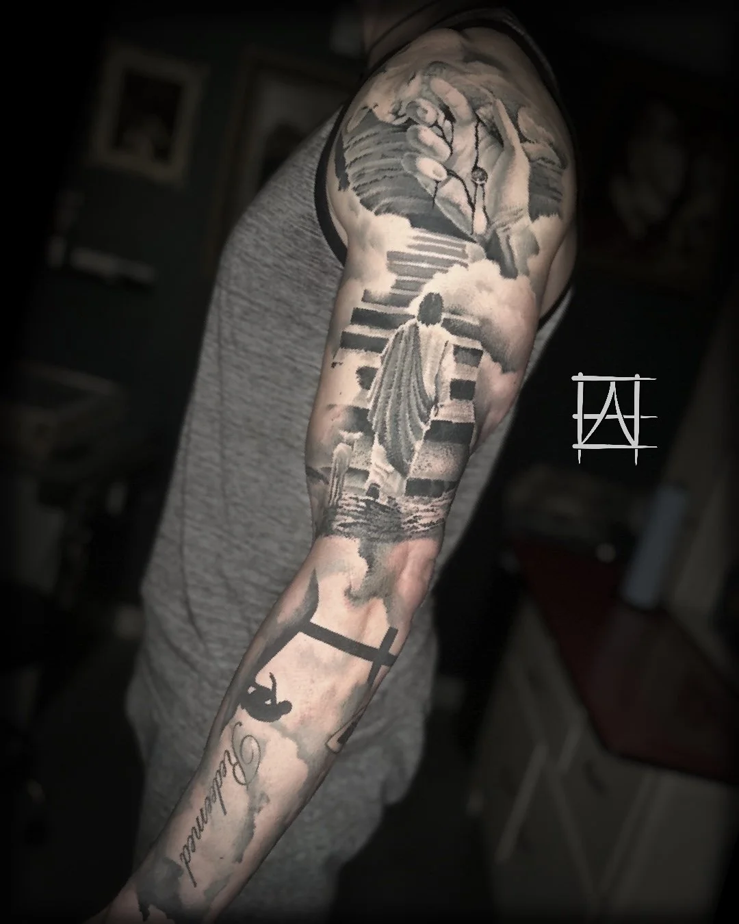 Tattoo sleeve featuring a person walking up stairs towards a sky with clouds, a dove flying above, a cityscape, a cross, and a silhouette of a person on a skateboard with the word 'Freedom' written.
