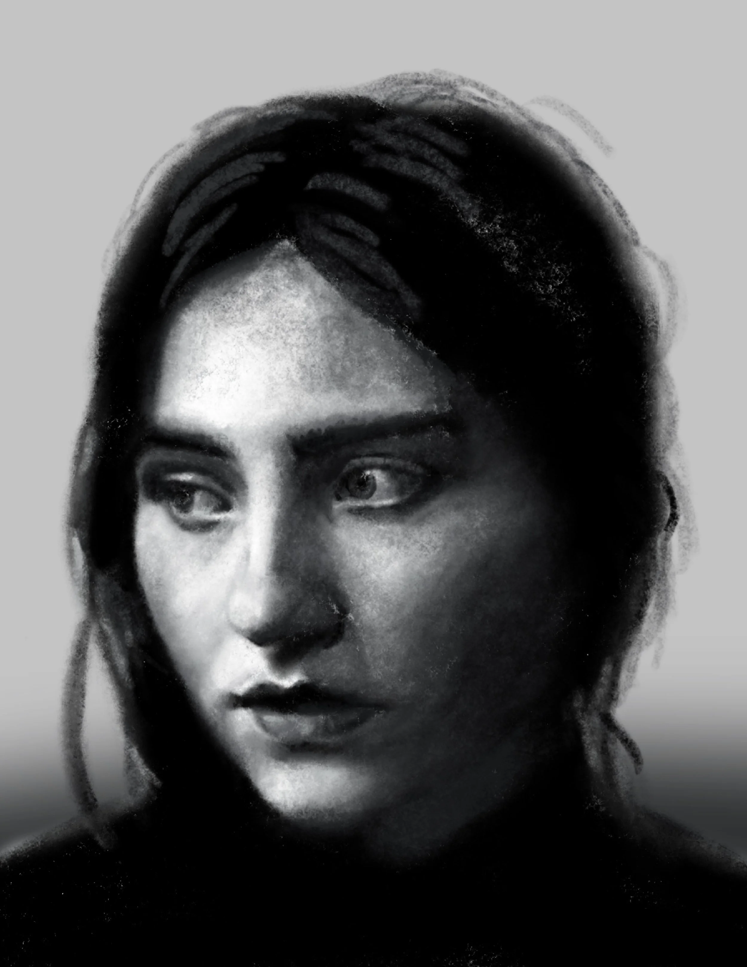 Close-up black and white photo of a woman's face highlighting her eyes, nose, and lips, with emphasis on her expressive gaze.