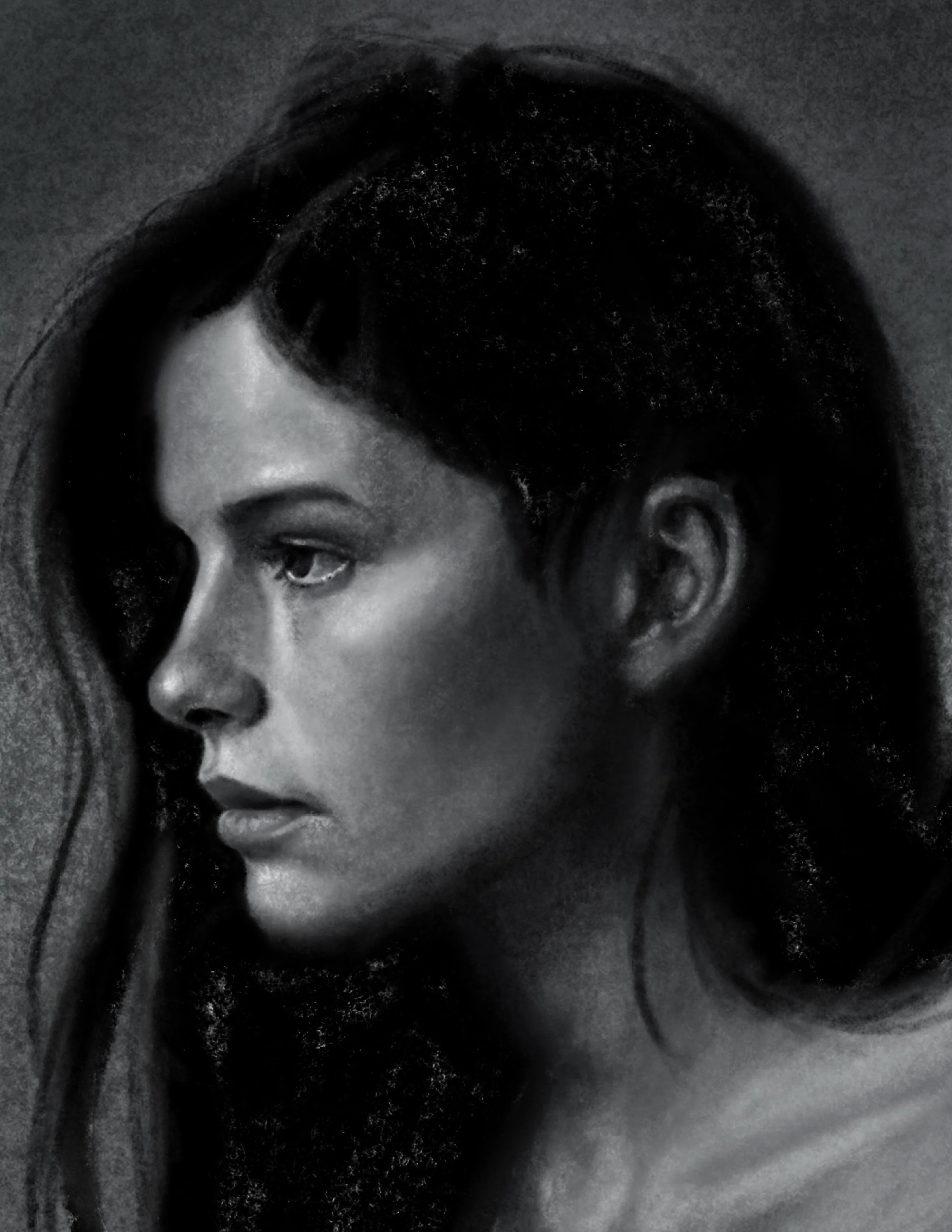 Close-up of a woman's face in black and white, showing her eye, nose, and partial lips with long hair.