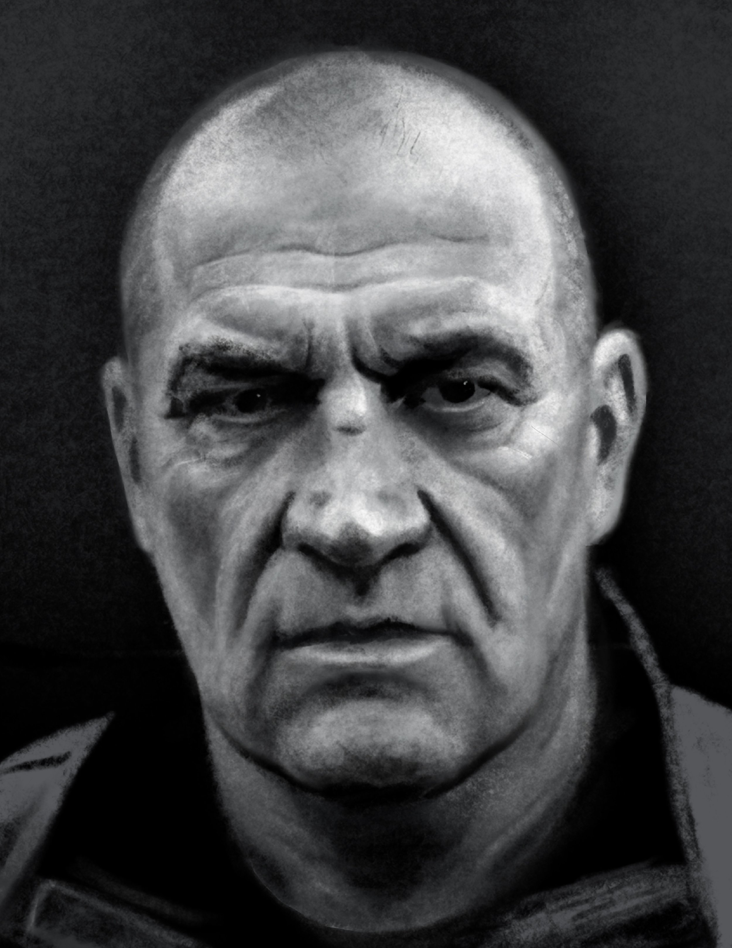A black and white close-up photograph of a person's face, showing emotional expression with furrowed brows, squinted eyes, and a serious or contemplative mood.