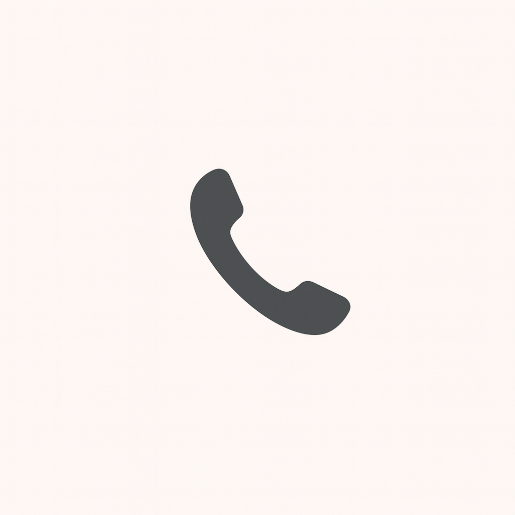 Icon of a black telephone handset on a white background.